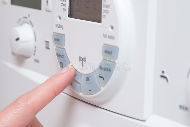 Finger Pressing Button on Electronic Device like Boiler stock images