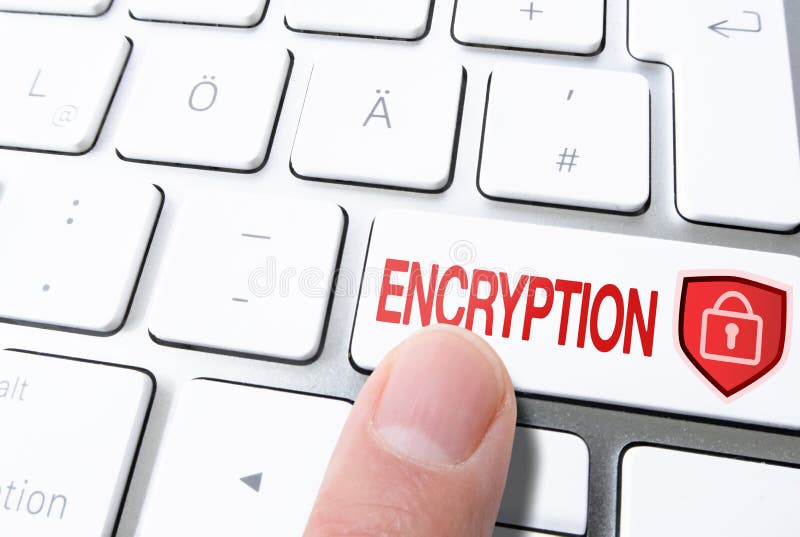 Finger pressing key on computer keyboard labeled ENCRYPTION with padlock on shield royalty free stock images