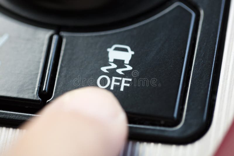 Finger pressing Traction Control System button stock photography