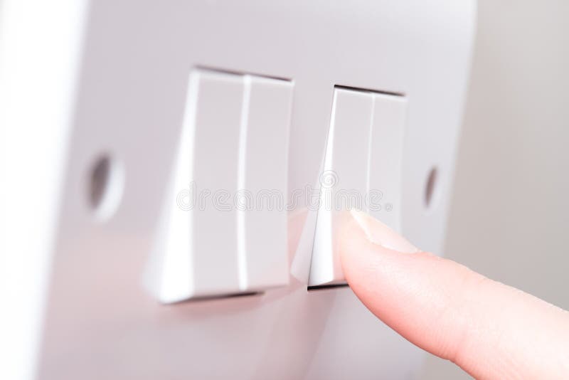 Finger Switching on Light on Wall royalty free stock photos