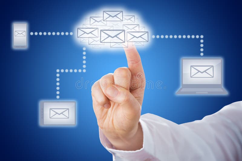 Host of email icons shaping a cloud symbol. The cloud computing icon does link to mobile devices that display a letter icon. Index finger of a business man is touching the cloud icon. Blue background. Host of email icons shaping a cloud symbol. The cloud computing icon does link to mobile devices that display a letter icon. Index finger of a business man is touching the cloud icon. Blue background.