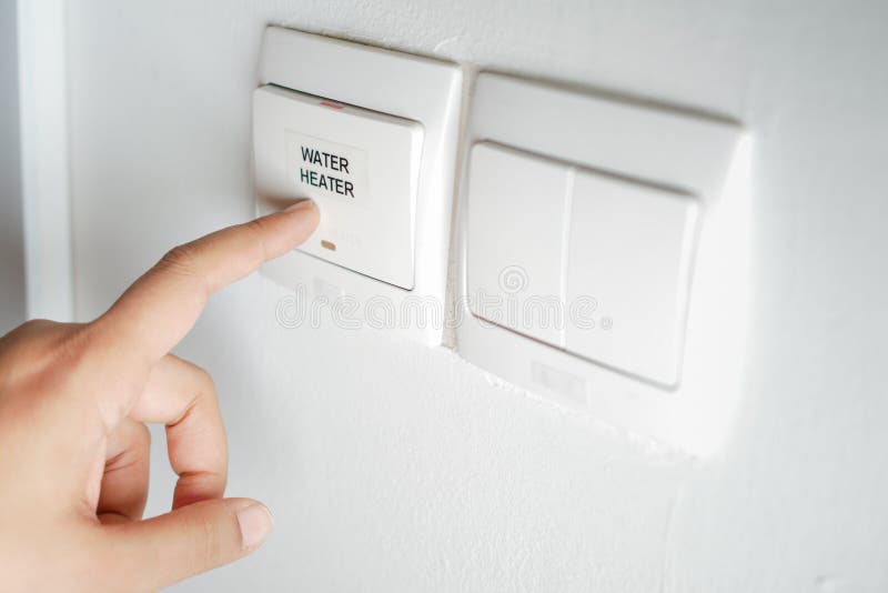 A finger turning on lighting switch. royalty free stock photo