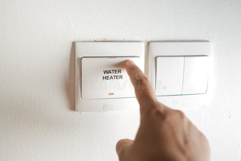 A finger turning on lighting switch. royalty free stock image