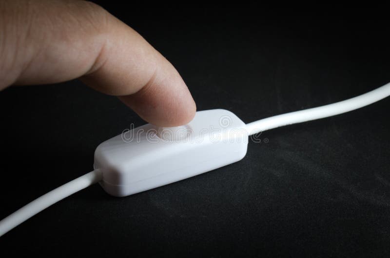 Finger turning on / off the switch of light stock image