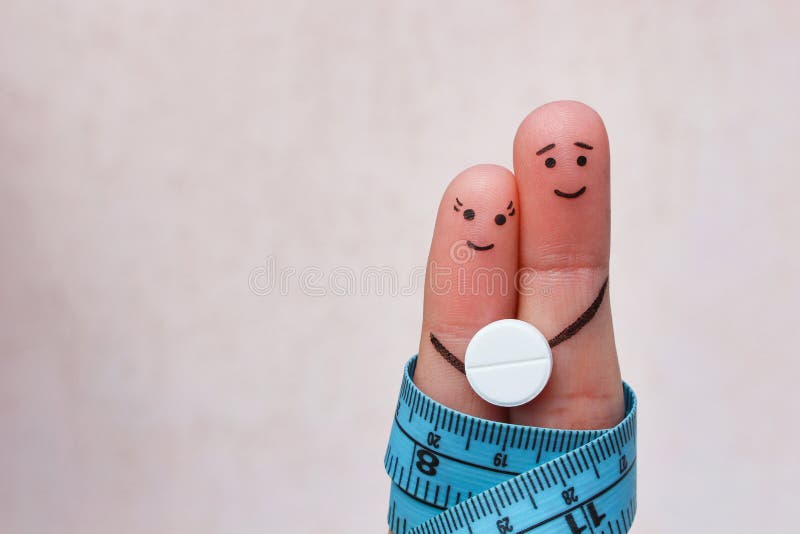 Fingers art of Happy couple. concept of man and woman on the pill for weight loss. Fingers art of Happy couple. The concept of a man and a woman on the pill for stock photo Fingers art of Happy couple. concept of man and woman on the pill for weight loss. Fingers art of Happy couple. The concept of a man and a woman on the pill for stock photo
