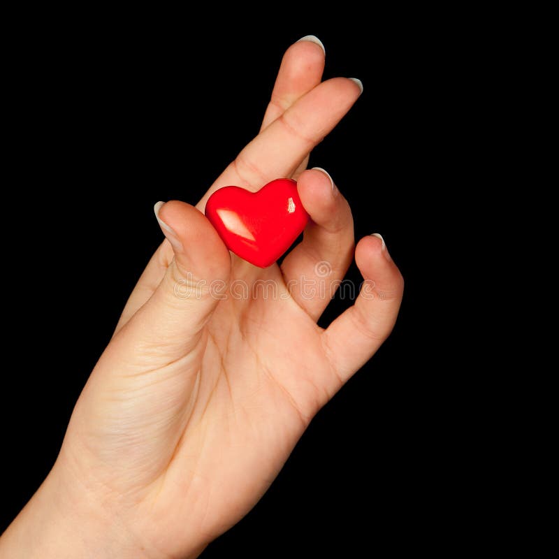 Fingers crossed with heart stock image. Image of manicure 12446445