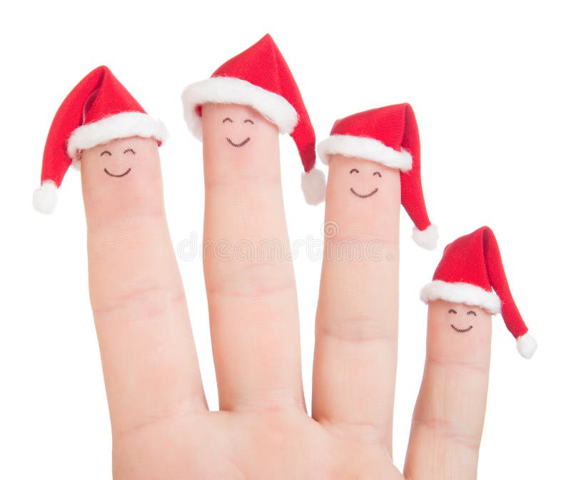 Fingers faces in Santa hats isolated on white background. Happy family celebrating concept for Christmas day. Fingers faces in Santa hats isolated on white background. Happy family celebrating concept for Christmas day.