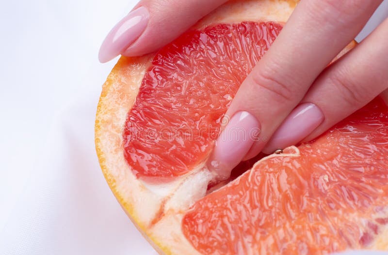 Fingers in grapefruit, woman masturbation and sex concept. 