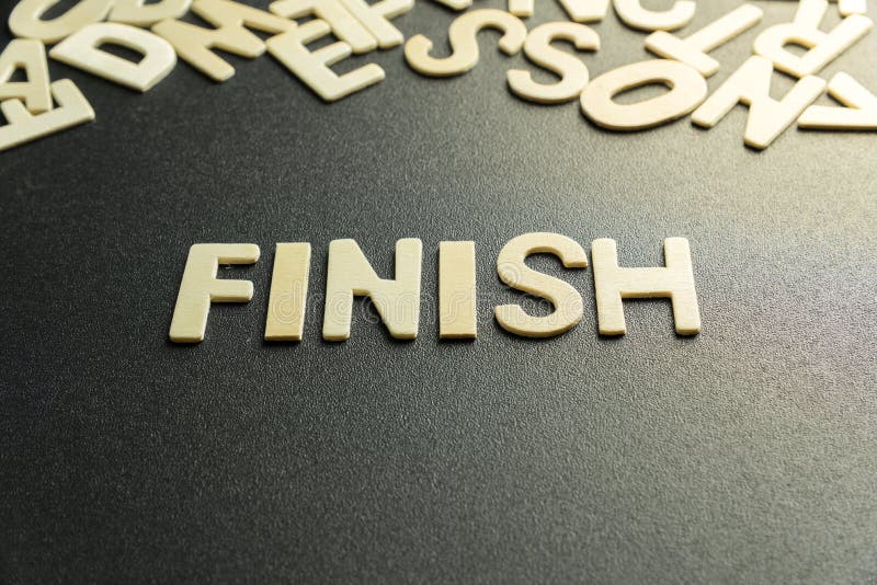 Word Finish On A Yellow Banner Against Blue Sky Stock Photo Image of