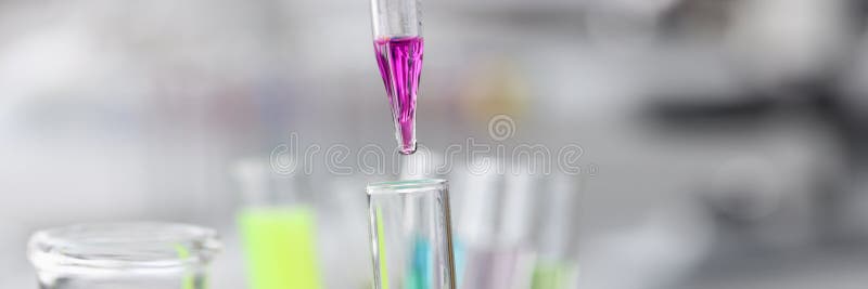 Purple liquid is dropped from pipette into test tube. Development of chemical compounds concept. Purple liquid is dropped from pipette into test tube. Development of chemical compounds concept