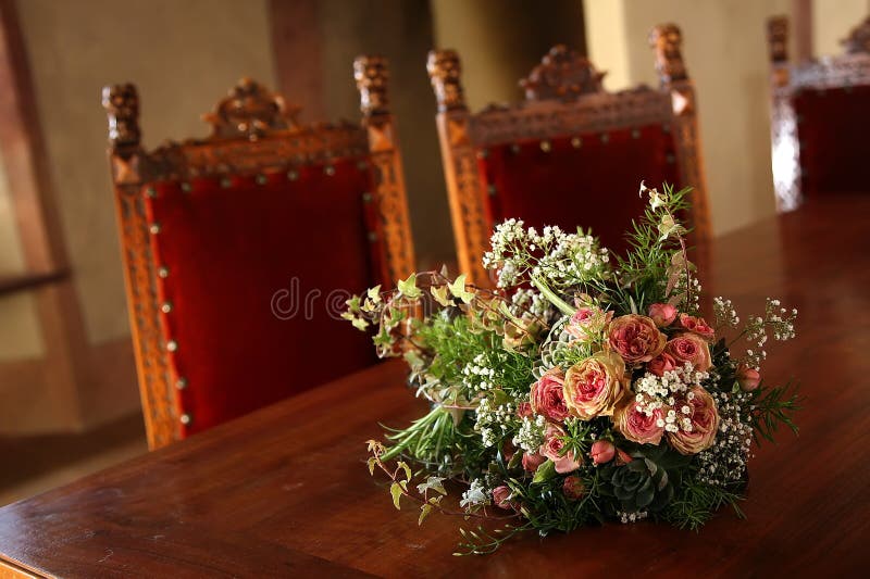 Wedding flowers on a brown deck. Wedding flowers on a brown deck