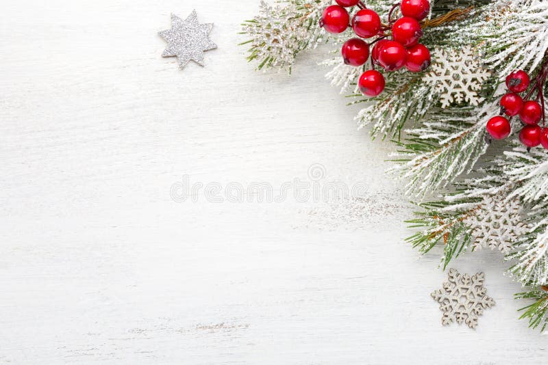 Fir branch with Christmas decorations on old wooden shabby background with empty space for text. Top view