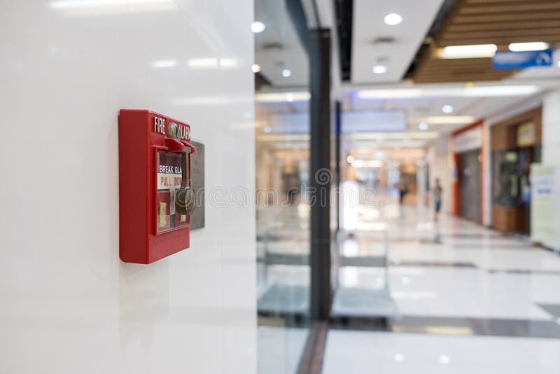 Fire alarm on the wall of shopping mall warning and security system stock images