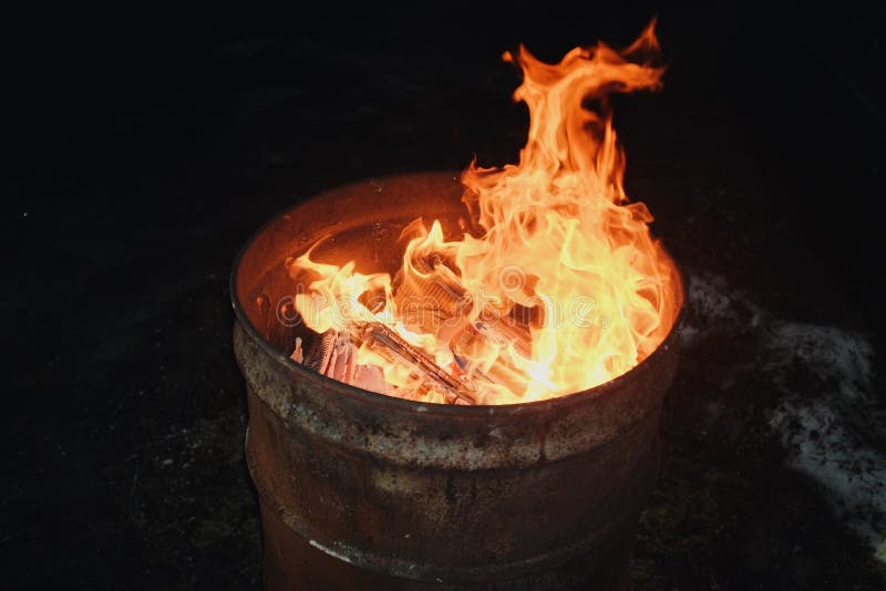 Fire Burning Inside a Metal Barrel Stock Photo Image of melt, flame