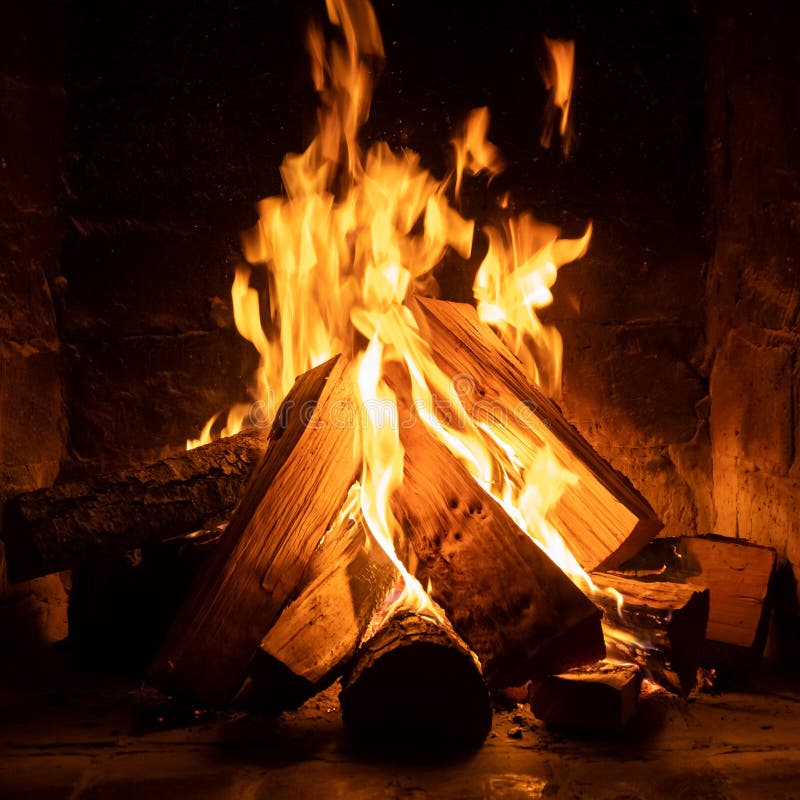 A fire burns in a fireplace  Fire to keep warm