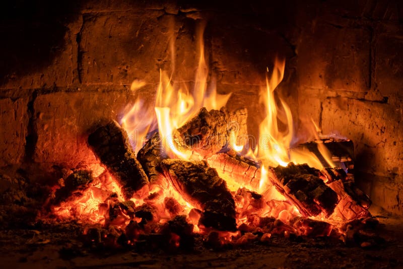 A fire burns in a fireplace  Fire to keep warm