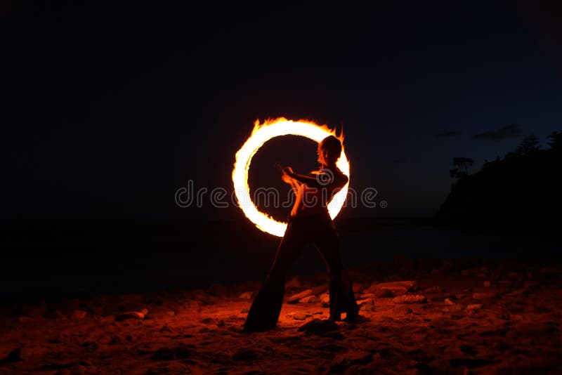 Fire Dance Along the Beach in the Dark