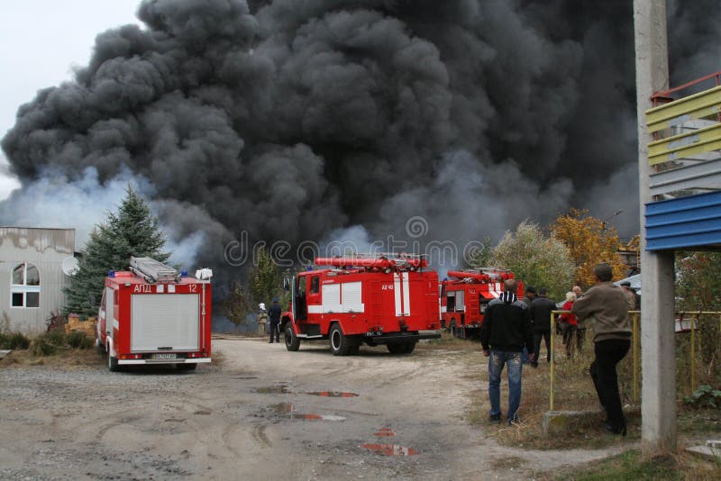 Fire Department in Action during Burning Warehouses with Plastic