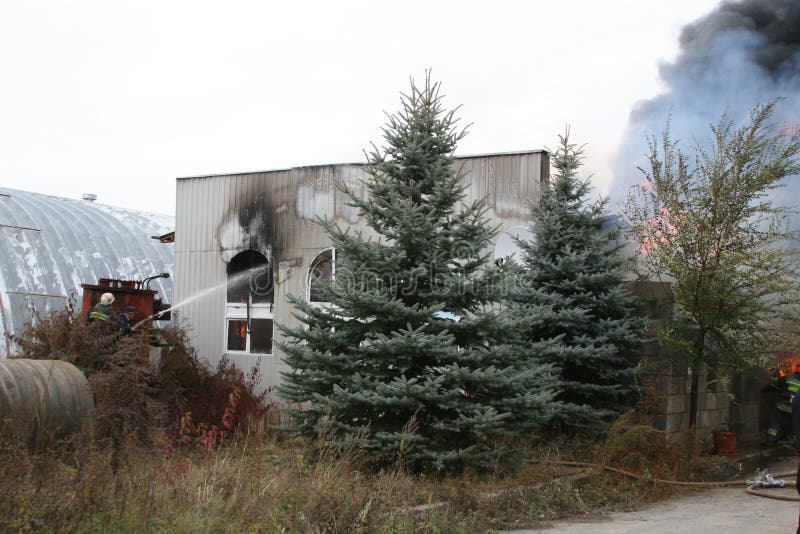 Fire Department in Action during Burning Warehouses with Plastic