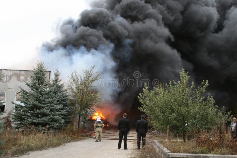 Fire Department in Action during Burning Warehouses with Plastic