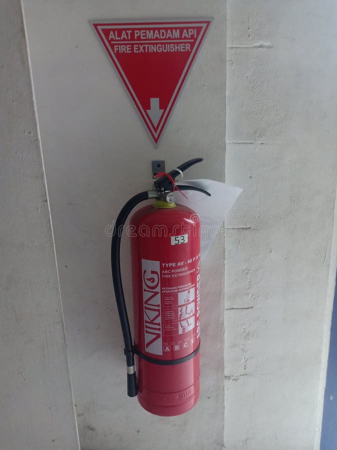 Fire Extinguisher on the Wall in Preparation for Guarding in Case of