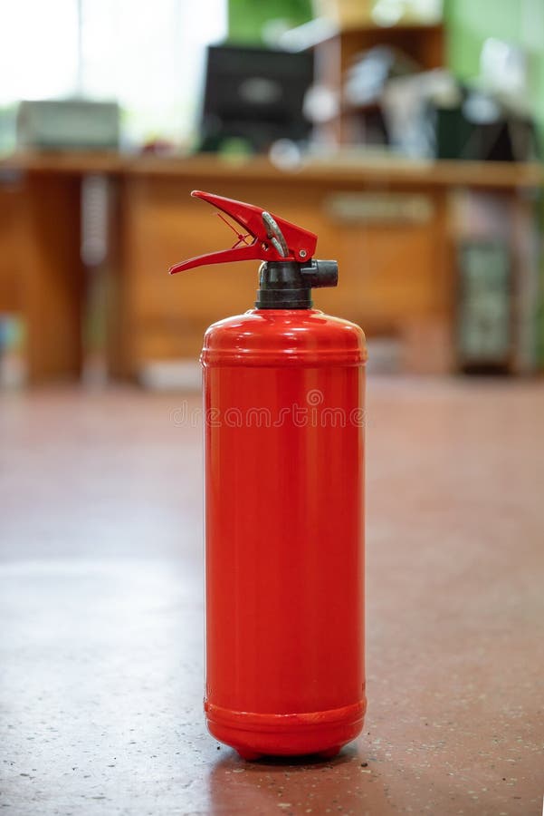Fire Extinguisher in Workplace Office. the Concept of Fire Safety Stock