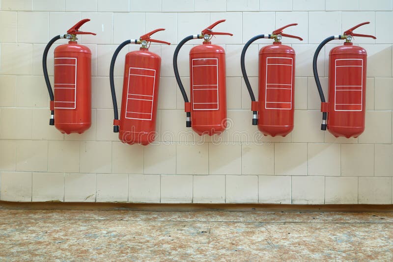 Fire extinguishers on the wall stock photo