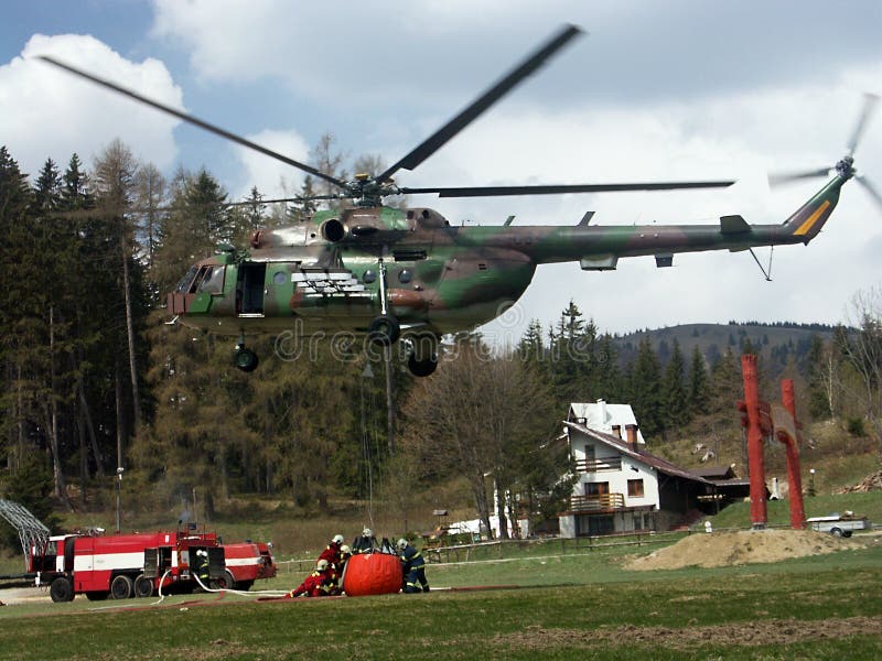 Fire-fighter and helicopter