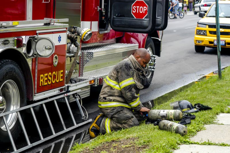 A Fireman at a House Fire in Downtown Toledo Editorial Stock Photo