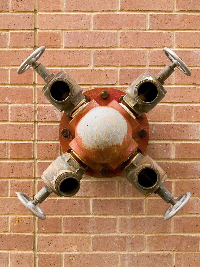 Fire hydrant on brick wall stock photo. Image of outside 649604