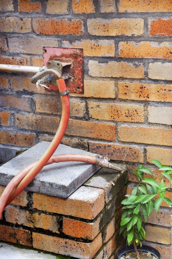 Fire Hydrant Hose Installed at Brick Wall Stock Image Image of