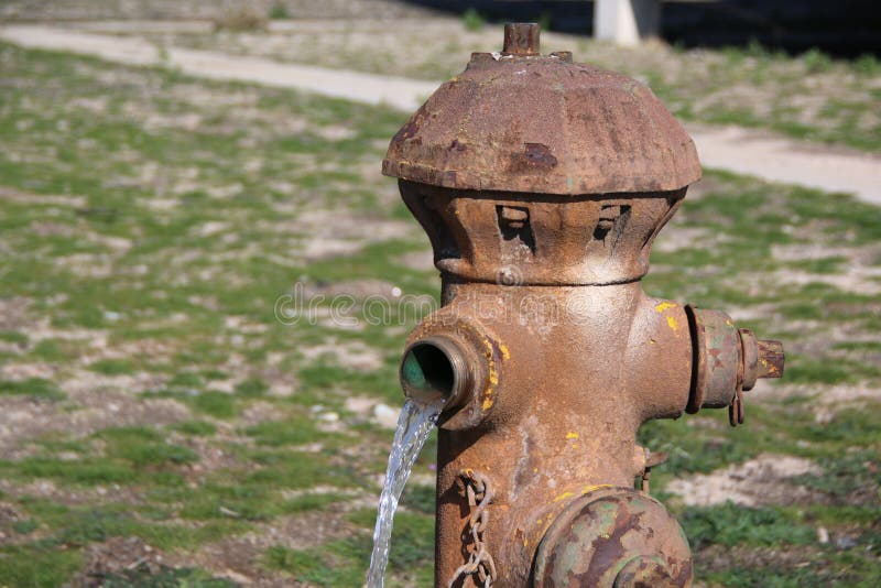 Fire Hydrant w Water 2 stock photo. Image of utility 228927590