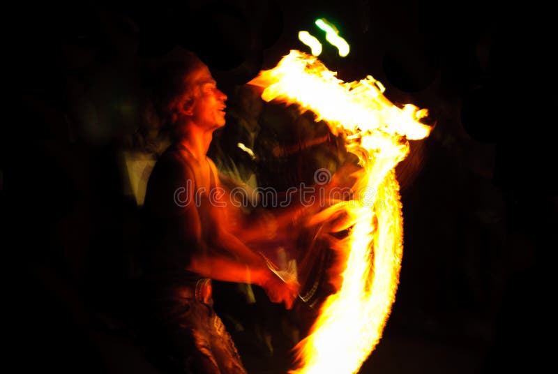 Fire Juggler at the part stock image Fire Juggler at the part stock image