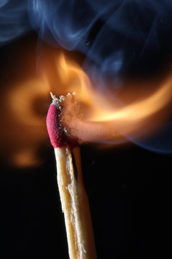 Close up macro of a burning match - just ignited. Close up macro of a burning match - just ignited