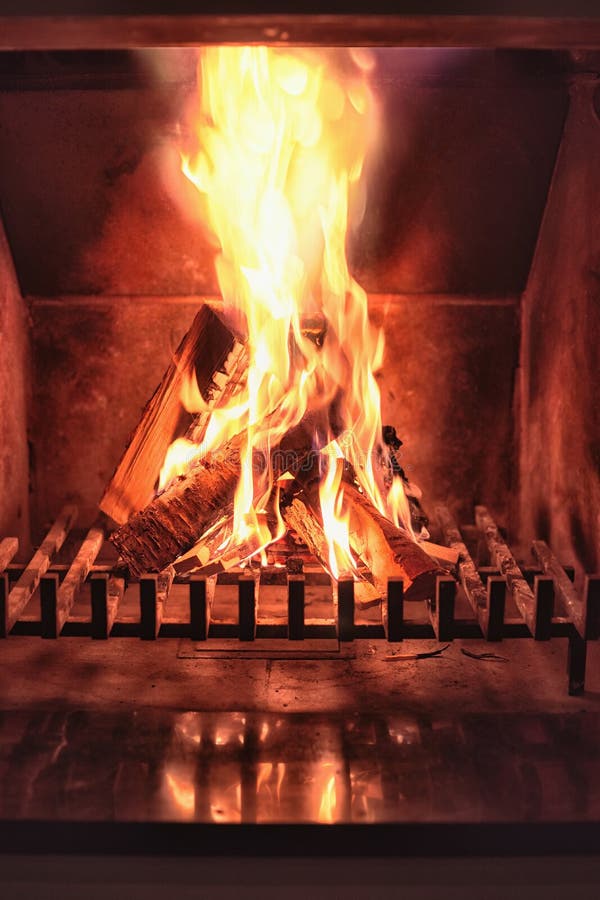 Fireplace and Burning Firewood. Traditional Heating Stock Photo Image
