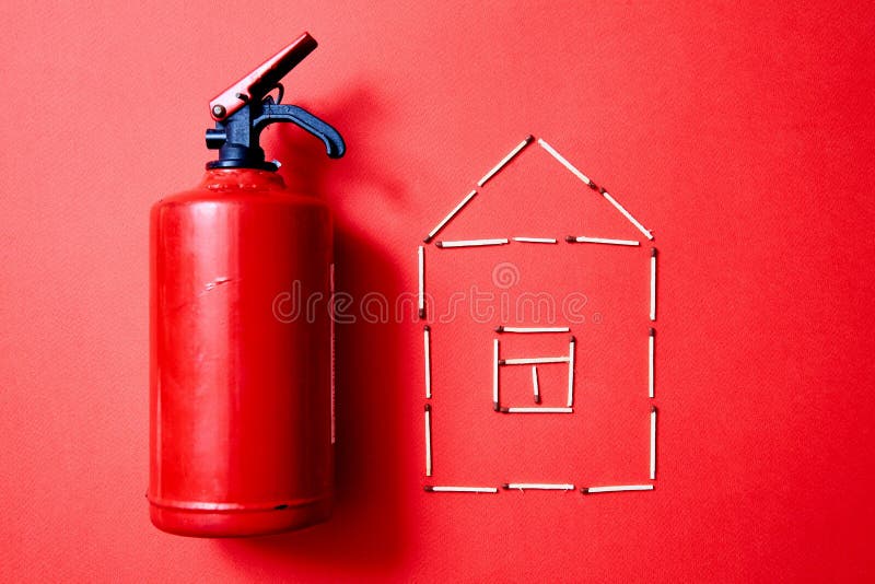 Fire safety, or security and protection concept. Fire extinguisher and the figure of the house of matches