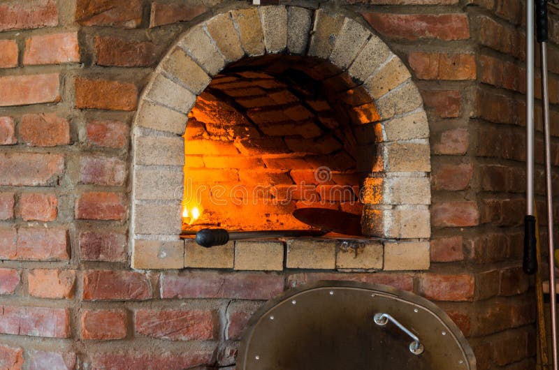 Fire in stone oven stock image. Image of natural, brick 101220101