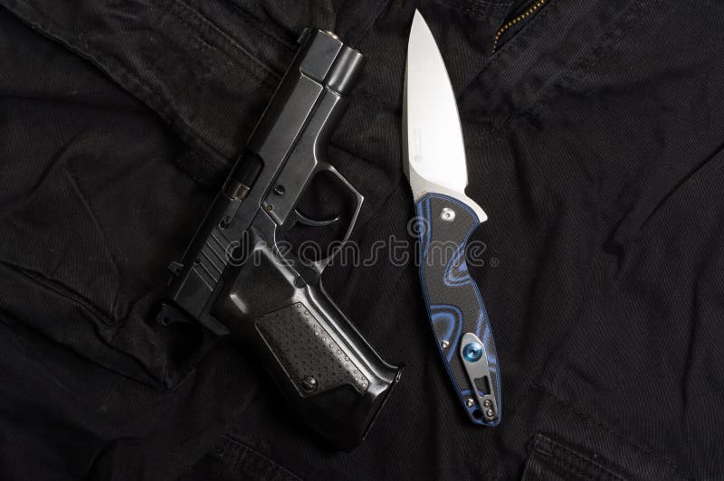 Firearm and Knife. Weapons and Men`s Clothing Stock Photo Image of