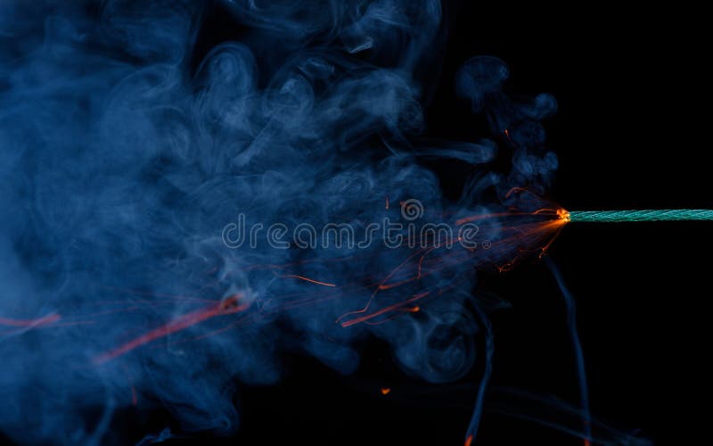 Burning Green Fuse Wick Cord With Sparks And Smoke On Blue Background Stock  Photo, Picture and Royalty Free Image. Image 140358329.