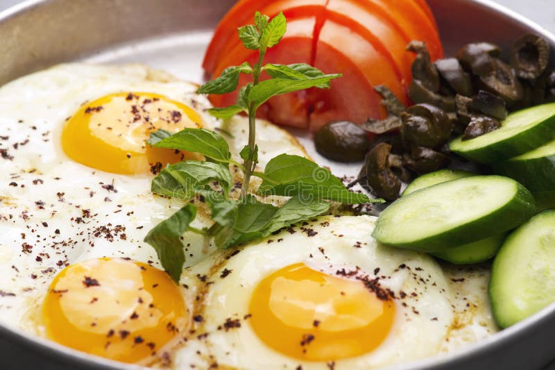 Fired Eggs Presentation with Mints, Tomato, Olive, Cucumber and Sumac
