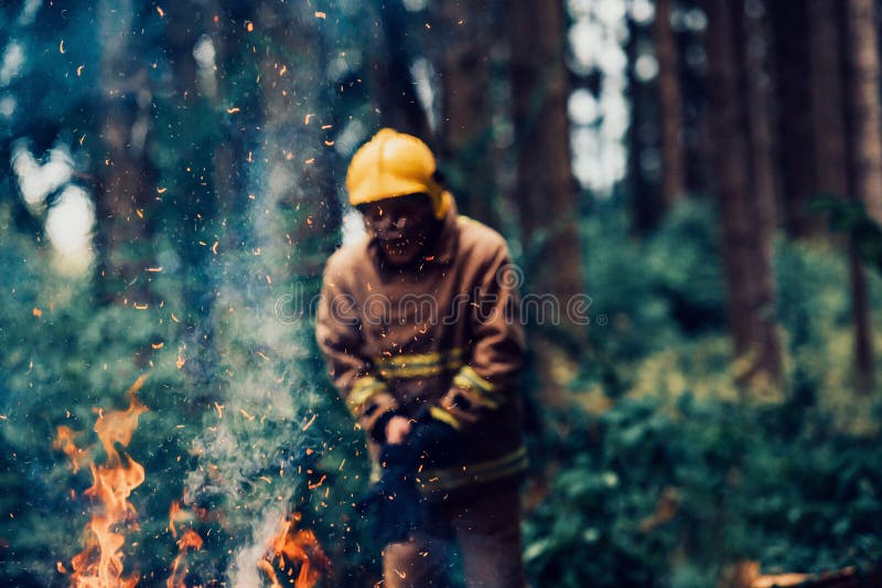 Firefighter at Job. Firefighter in Dangerous Forest Areas Surrounded by