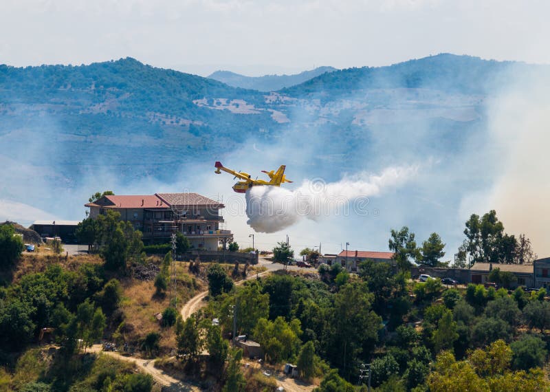 A firefighter plane during a mission stock image