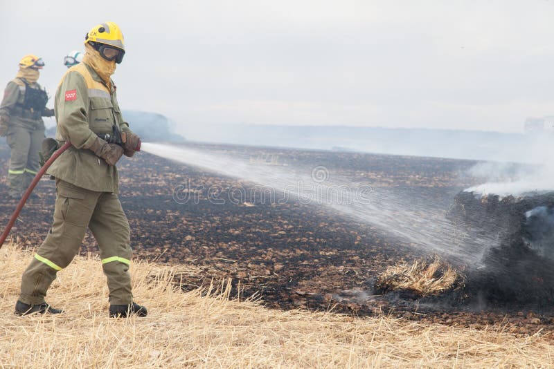 Firefighters putting out fire royalty free stock images Firefighters putting out fire royalty free stock images