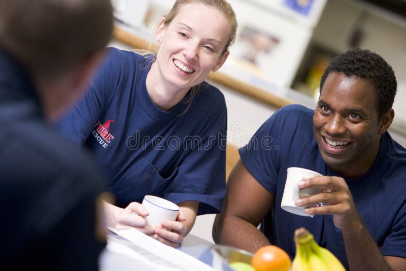 Firefighters relaxing in the staff kitchen royalty free stock images Firefighters relaxing in the staff kitchen royalty free stock images