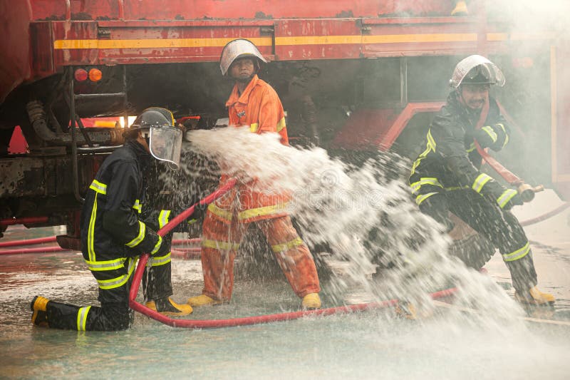 Firefighters Use Powerful Water To Extinguish the Fire. during the Fire