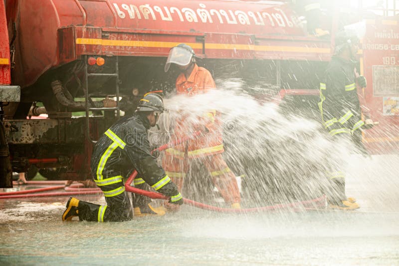 Firefighters Use Powerful Water To Extinguish the Fire. during the Fire