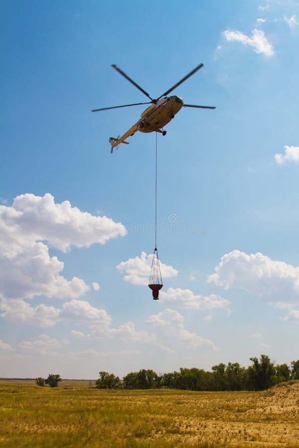 Firefighting Helicopter with Fire Bucket Flies Stock Photo Image of