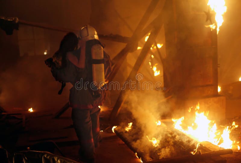 Fireman with accident victim stock image