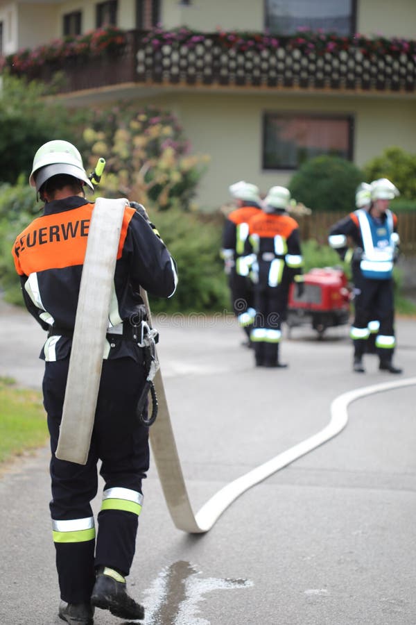 Fireman with hose over shoulder shoulders royalty free stock photos Fireman with hose over shoulder shoulders royalty free stock photos