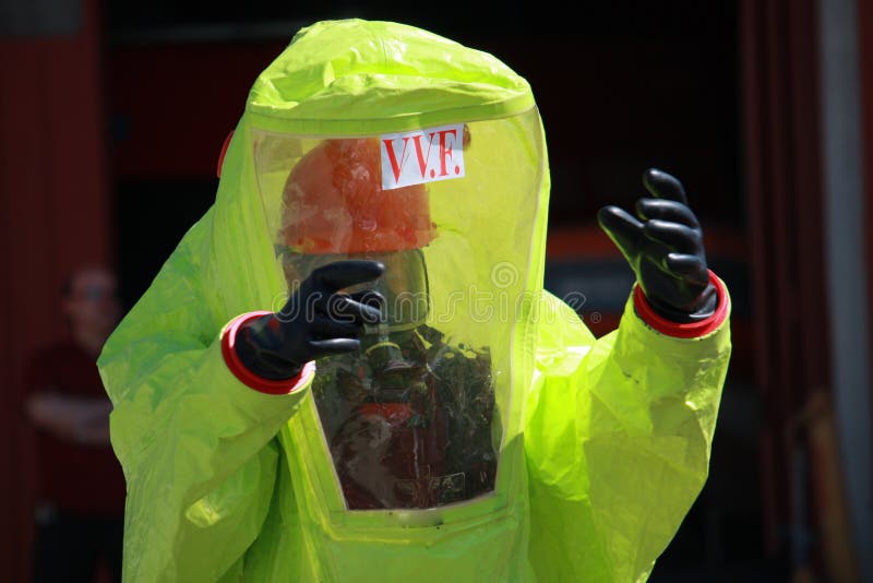 Fireman with a suit for protection from the risk of biological a royalty free stock photo